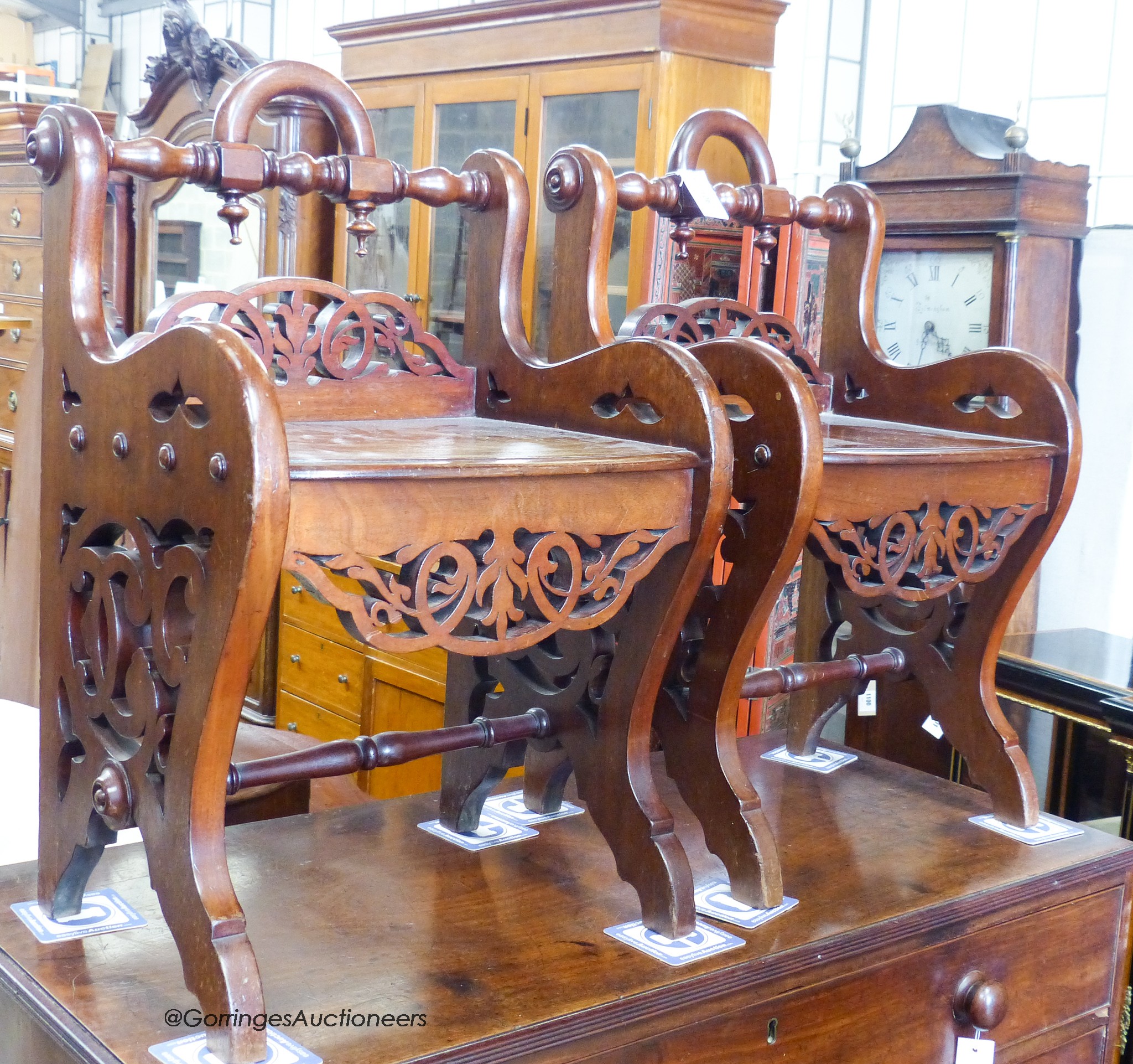 A pair of Victorian mahogany hall seats in the manner of Shoolbred. W-47, D-38, H-76cm.